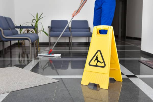 cleaning company mopping shiny floors
