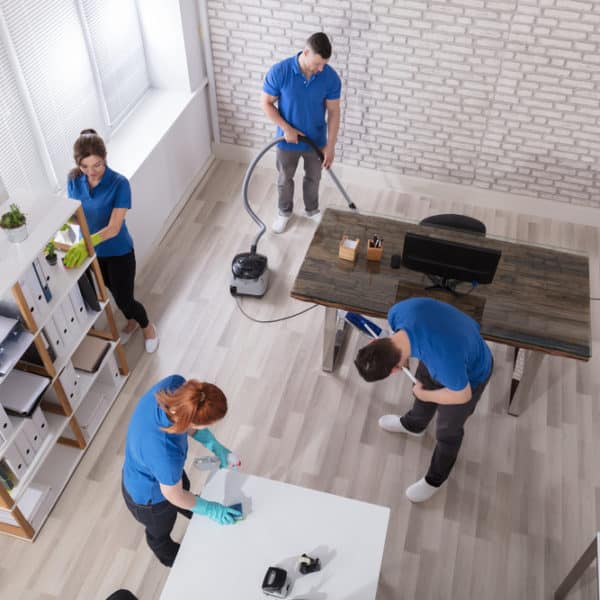 Commercial Cleaning Company Technicians in a modern office setting